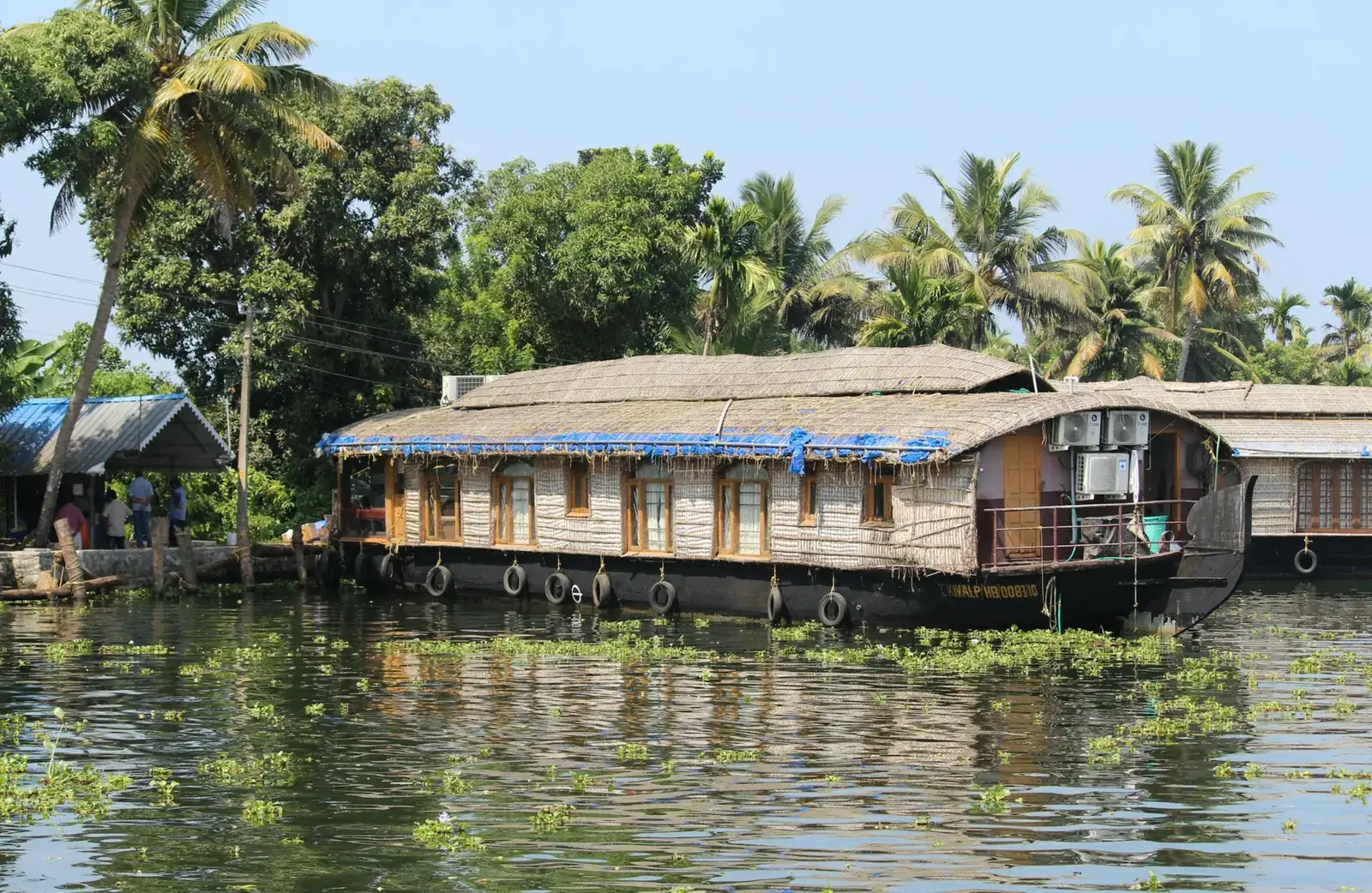 Thatched Kerala houseboat on an Alleppey canal